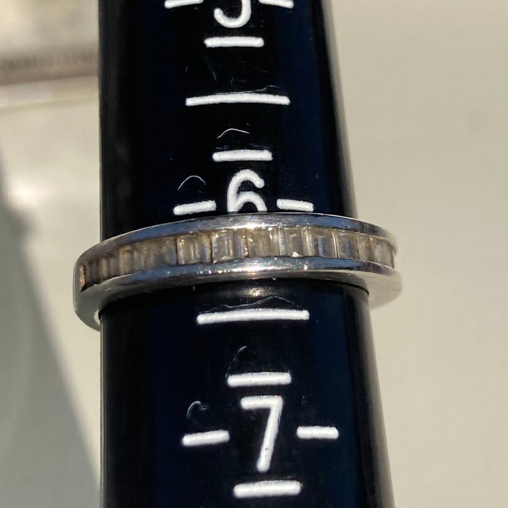 Sterling silver ring inset with clear glass gems
